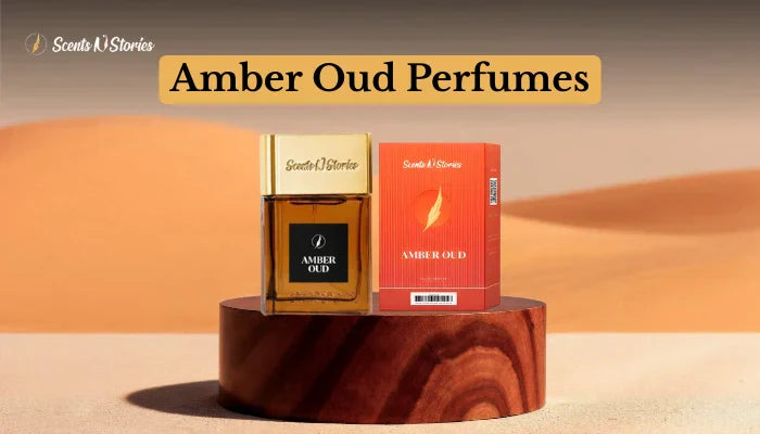 A professional product shot for Scents N Stories titled "Amber Oud Perfumes" featuring a gold-capped bottle and an elegant orange box in a desert setting.
